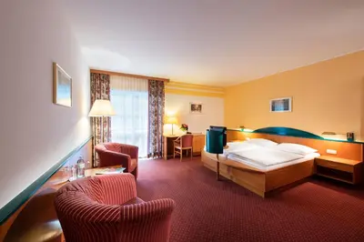 Ein Bett oder Betten in einem Zimmer der Unterkunft EVIVA im Parkhotel