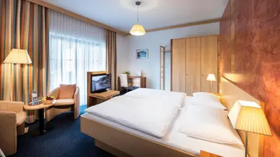 Ein Bett oder Betten in einem Zimmer der Unterkunft EVIVA im Parkhotel