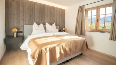 Ein Bett oder Betten in einem Zimmer der Unterkunft Sunleitn-Residenz