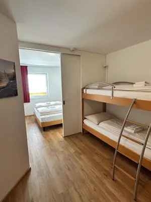 Ein Bett oder Betten in einem Zimmer der Unterkunft FREJA Tauern Apartments by Langeder