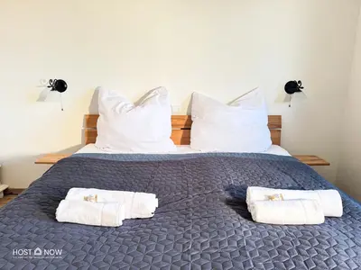 Ein Bett oder Betten in einem Zimmer der Unterkunft Alpen Panorama 2 - Lachtal Apartments