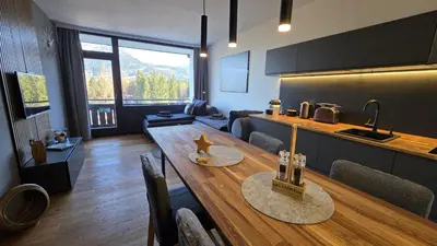 Ein Sitzbereich in der Unterkunft Dachstein104