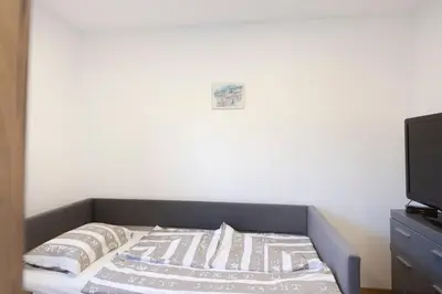Ein Bett oder Betten in einem Zimmer der Unterkunft Appartements Gasthaus Eichholzer