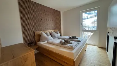 Ein Bett oder Betten in einem Zimmer der Unterkunft AlpinHerz Bio Penthouse Apartment