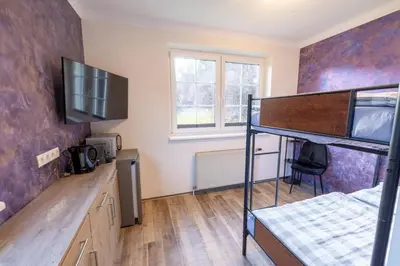 Ein Bett oder Betten in einem Zimmer der Unterkunft Apartmenthaus 113
