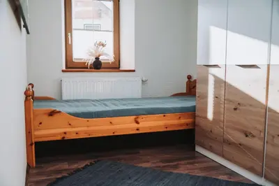 Ein Bett oder Betten in einem Zimmer der Unterkunft Aichlburg Appartement