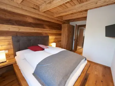 Ein Bett oder Betten in einem Zimmer der Unterkunft Holiday Home Chalet Almidylle in Sankt Martin am Tennengebirge by Interhome