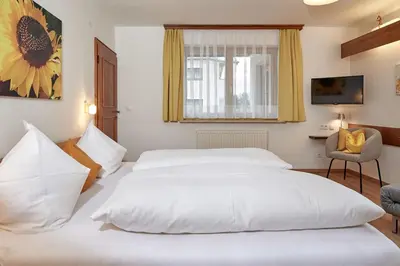 Ein Bett oder Betten in einem Zimmer der Unterkunft Landhaus Gollegger Appartements Flachau