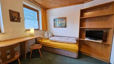 Ein Bett oder Betten in einem Zimmer der Unterkunft Landhaus Gollegger Appartements Flachau