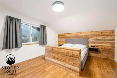 Ein Bett oder Betten in einem Zimmer der Unterkunft StoderLodge - Alpine Garden Residence - by myNests