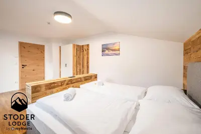 Ein Bett oder Betten in einem Zimmer der Unterkunft StoderLodge - Alpine Garden Residence - by myNests