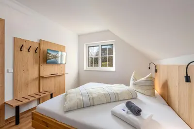 Ein Bett oder Betten in einem Zimmer der Unterkunft Stieglerhof Bergrefugium & Kaiblingblick - by myNests