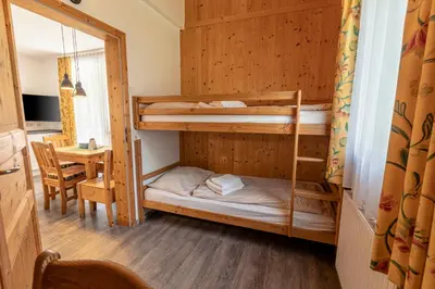 Ein Bett oder Betten in einem Zimmer der Unterkunft FerienPark Kreischberg Ferienhäuser by ALPS RESORTS