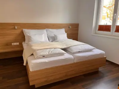 Ein Bett oder Betten in einem Zimmer der Unterkunft Ramsaublick