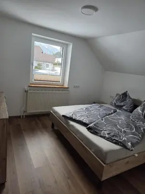 Ein Bett oder Betten in einem Zimmer der Unterkunft Apartment Altenberger