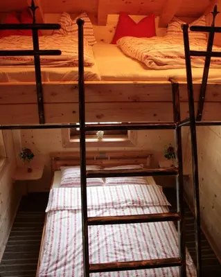 Ein Bett oder Betten in einem Zimmer der Unterkunft Hütte Monigold