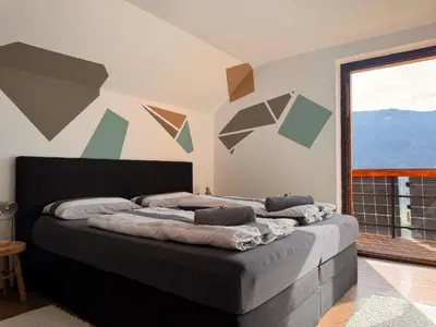 Ein Bett oder Betten in einem Zimmer der Unterkunft Wind Buam Huette
