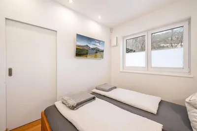 Ein Bett oder Betten in einem Zimmer der Unterkunft Apartment Höchstein - Stone & Light Residence - by myNests