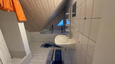 Ein Badezimmer in der Unterkunft Ferienwohnung Roseggersiedlung