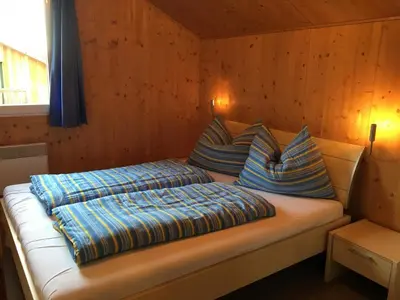 Ein Bett oder Betten in einem Zimmer der Unterkunft Ferienhaus annaberg36 Dachstein-West