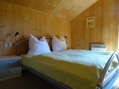 Ein Bett oder Betten in einem Zimmer der Unterkunft Ferienhaus annaberg36 Dachstein-West