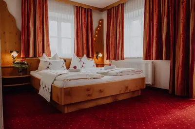 Ein Bett oder Betten in einem Zimmer der Unterkunft Panorama Hotel Leidingerhof