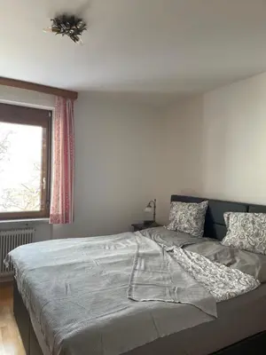 Ein Bett oder Betten in einem Zimmer der Unterkunft AAA Ferienwohnung Bad Ischl