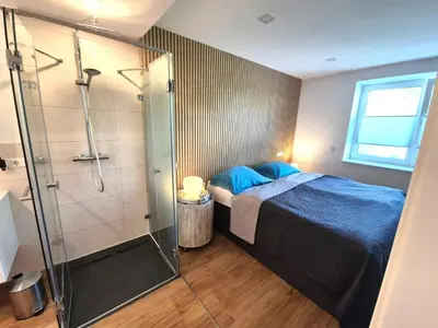 Ein Bett oder Betten in einem Zimmer der Unterkunft NewWorkCenter Apartments