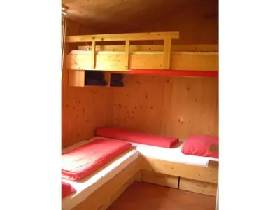 Ein Bett oder Betten in einem Zimmer der Unterkunft Chalet Alpendorf Dachstein West 15