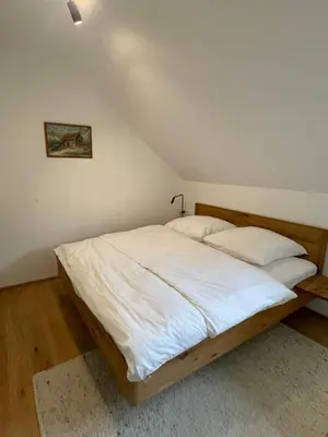 Ein Bett oder Betten in einem Zimmer der Unterkunft Grimming Alpin Apartment