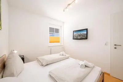Ein Bett oder Betten in einem Zimmer der Unterkunft Peak Access Haus im Ennstal - by myNests