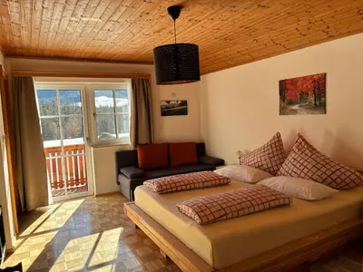 Ein Bett oder Betten in einem Zimmer der Unterkunft Haus Egglmeier Doppelzimmer mit Bergblick
