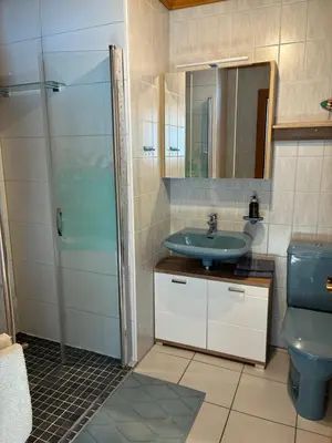 Ein Badezimmer in der Unterkunft Haus Egglmeier Doppelzimmer mit Bergblick