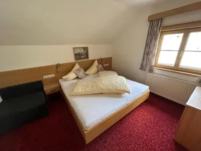 Ein Bett oder Betten in einem Zimmer der Unterkunft Blashof seit 1693 - Apartments Schladming