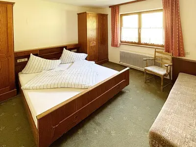 Ein Bett oder Betten in einem Zimmer der Unterkunft Blashof seit 1693 - Apartments Schladming
