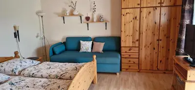 Ein Bett oder Betten in einem Zimmer der Unterkunft Ferienwohnung Hohengaßner
