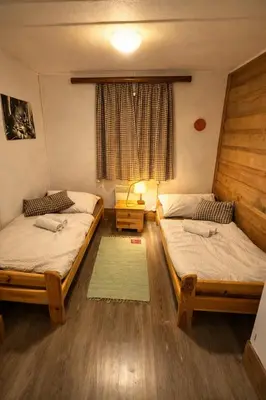 Ein Bett oder Betten in einem Zimmer der Unterkunft Privates Alpenchalet mit Außensauna