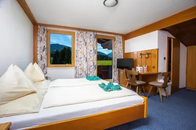 Ein Bett oder Betten in einem Zimmer der Unterkunft Berghof Mitterberg