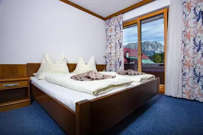 Ein Bett oder Betten in einem Zimmer der Unterkunft Berghof Mitterberg