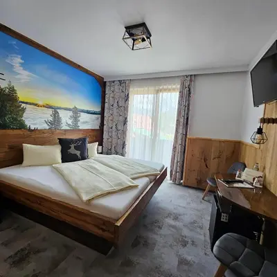 Ein Bett oder Betten in einem Zimmer der Unterkunft Berghof Mitterberg