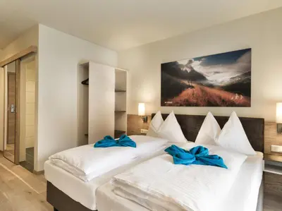Ein Bett oder Betten in einem Zimmer der Unterkunft Hotel Sportwelt