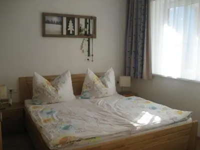Ein Bett oder Betten in einem Zimmer der Unterkunft Appartement Alpenglück