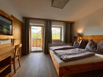 Ein Bett oder Betten in einem Zimmer der Unterkunft La Montana Ski & Hiking LODGE