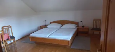 Ein Bett oder Betten in einem Zimmer der Unterkunft Ferienwohnung Weitgasser