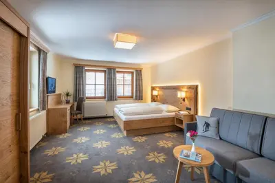 Ein Bett oder Betten in einem Zimmer der Unterkunft Aparthotel Weningeralm