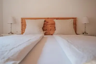 Ein Bett oder Betten in einem Zimmer der Unterkunft Attwengerhof