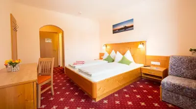 Ein Bett oder Betten in einem Zimmer der Unterkunft Pension Steiermark