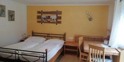 Ein Bett oder Betten in einem Zimmer der Unterkunft Abenteuerhof