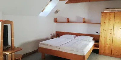 Ein Bett oder Betten in einem Zimmer der Unterkunft Abenteuerhof