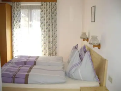 Ein Bett oder Betten in einem Zimmer der Unterkunft Haus Gsenger